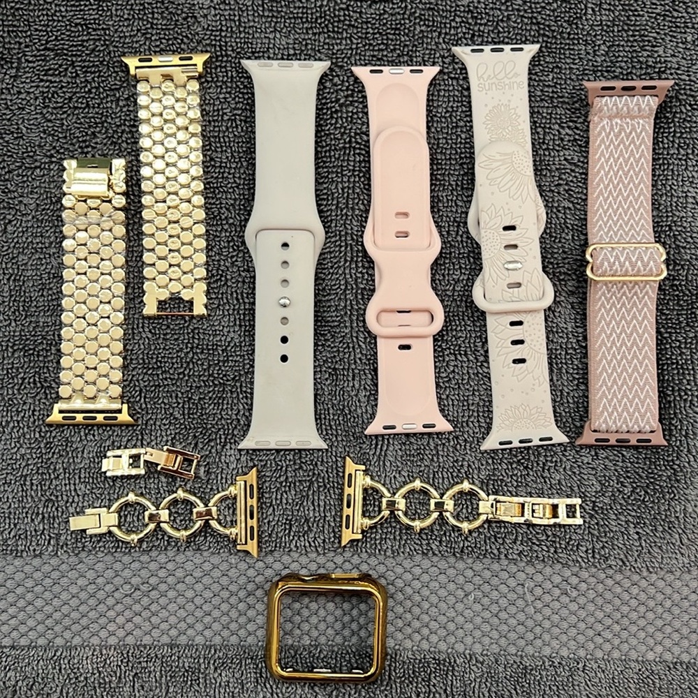 Variety women’s Apple smart watch bands (2) Gold, (2) beige, (2) pink.
